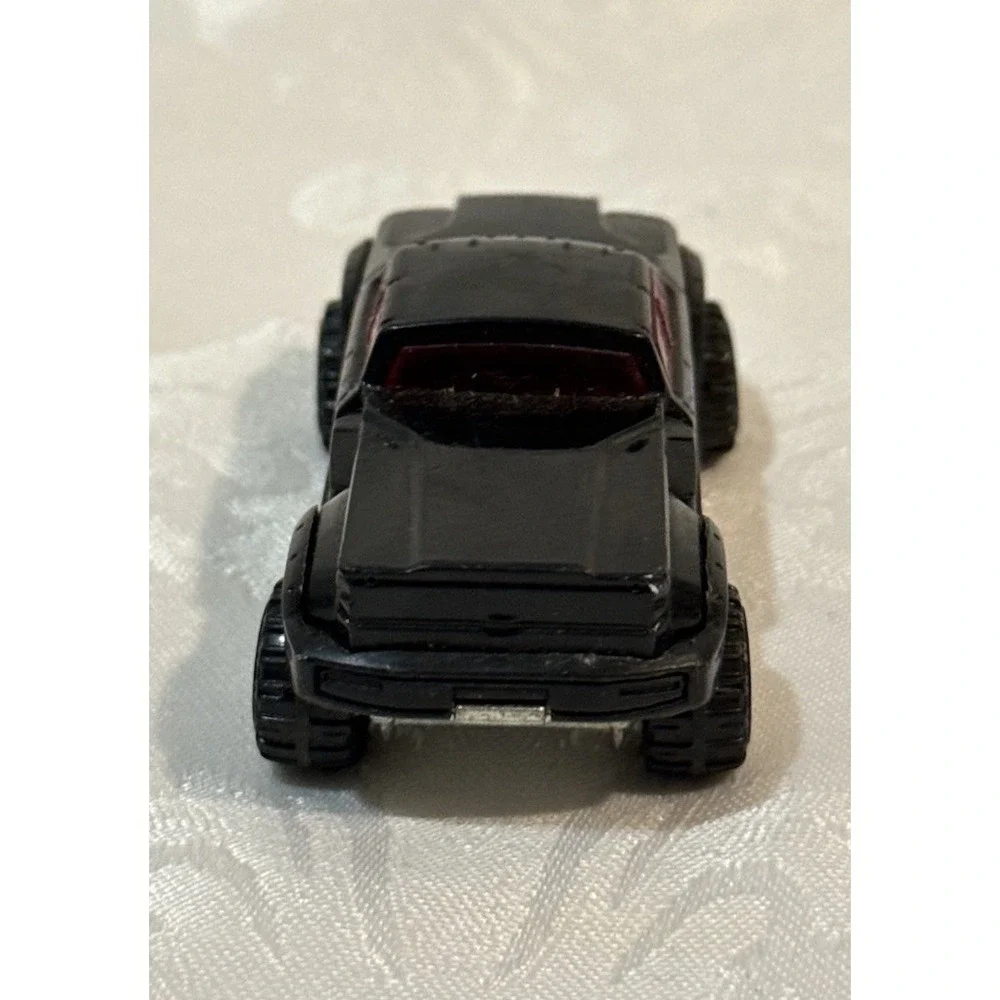 Hot Wheels Mega Duty black pickup truck, specifically the 2010 Heat Fleet